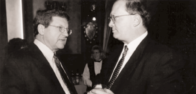 Foreign Minister Lloyd Axworthy and IRPP President Hugh Segal are talking to each other.