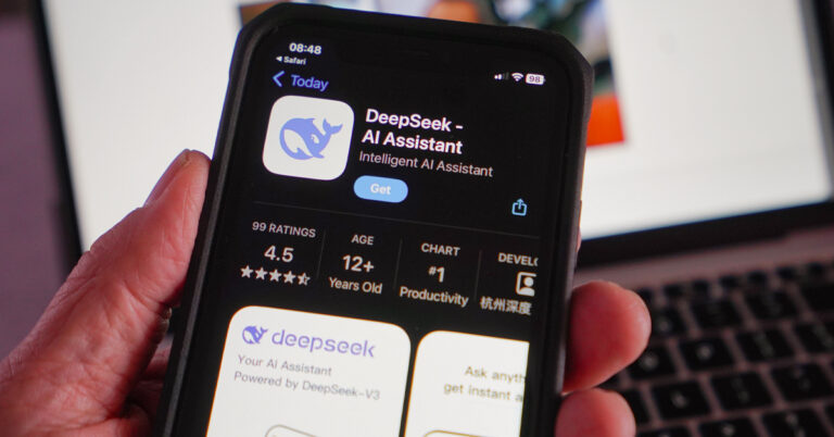 Close-up of a smartphone screen and a hand preparing to download the DeepSeek application.