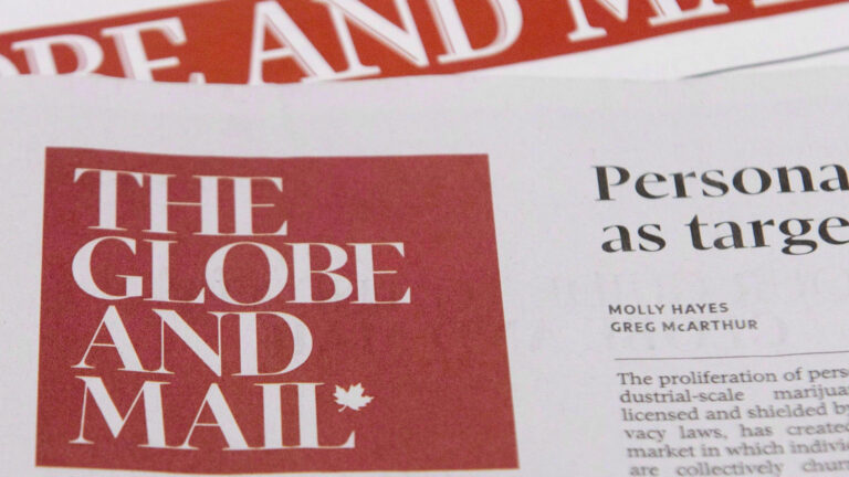 A close-up of two paper versions of the Globe and Mail.