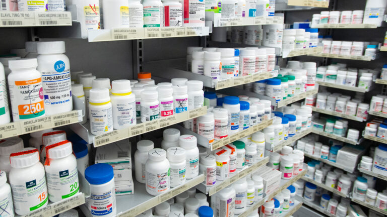Shelves of pill bottles.