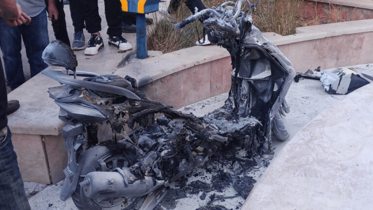 A badly burned moped.