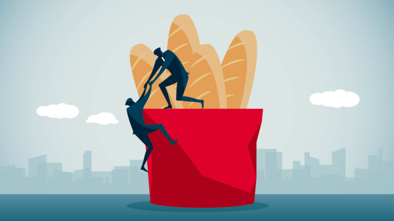 An illustration of the figure of a miniature human standing on the edge of a bread basket hauling up another person.