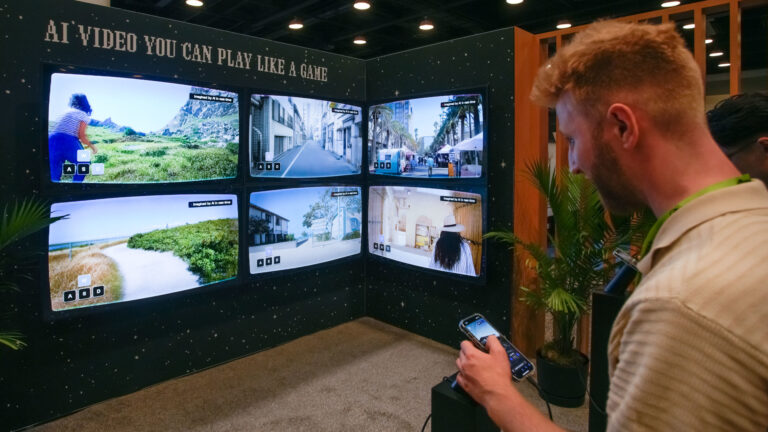 A man stands in front of six screens showing AI-generated videos.