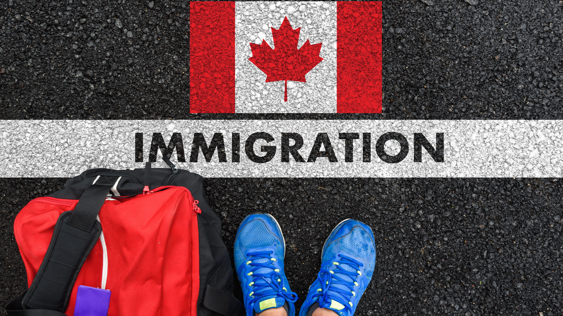 The word "immigration" is written on a white line that divides an asphalt surface in two. On one side, the Canadian flag, painted on the ground. On the other, a red travel bag and a pair of feet in blue sneakers.