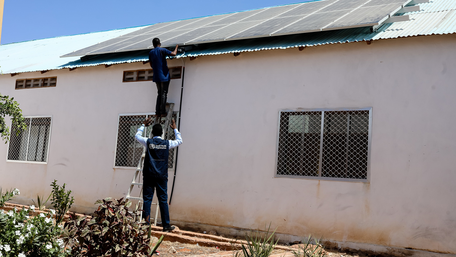 Workers-install-solar-panels