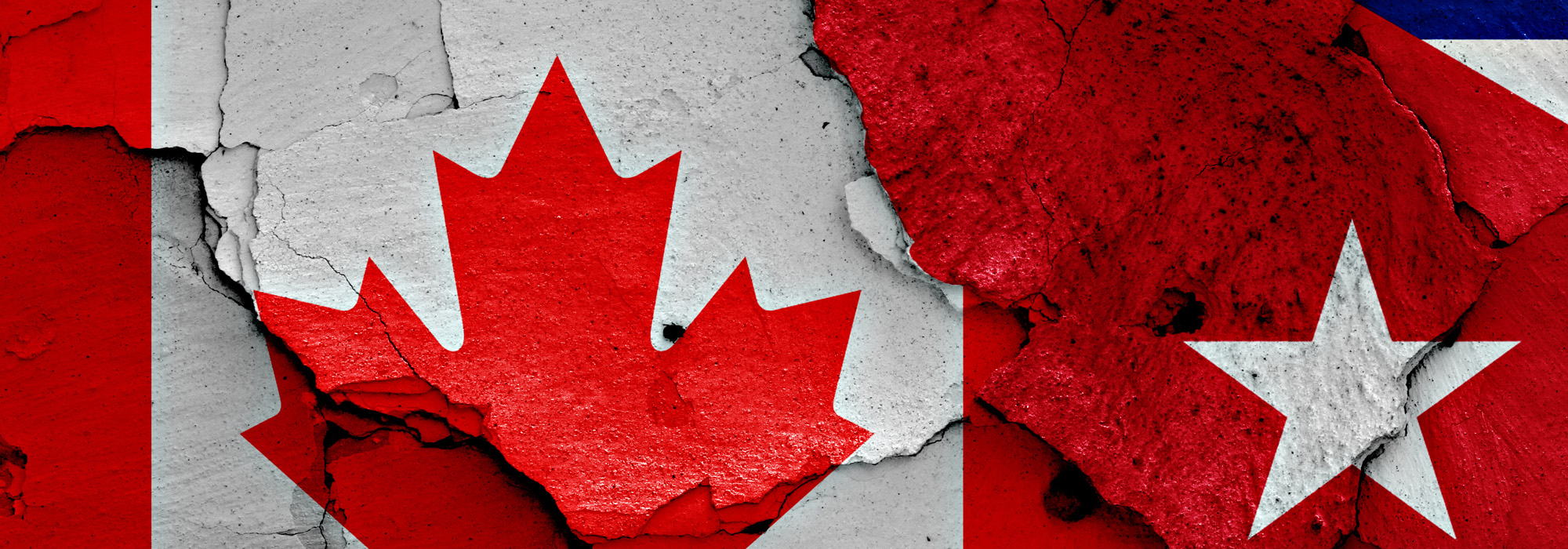 flags-of-canada-and-cuba-painted-on-cracked