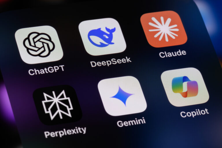The language learning model app logos on an iphone, including ChatGPT, DeepSeek, Anthropic Claude, Perplexity, Google Gemini, Microsoft Copilot.
