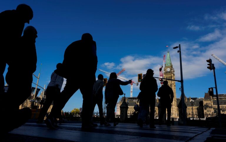 People cross Wellington Street on their way to Parliament Hill, a day before the return of the House of Commons, on Sunday, Sept. 14, 2025.