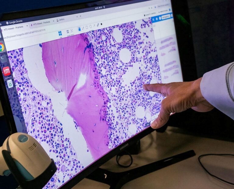 A hand points at a screen showing an array of purple dots and swipes.