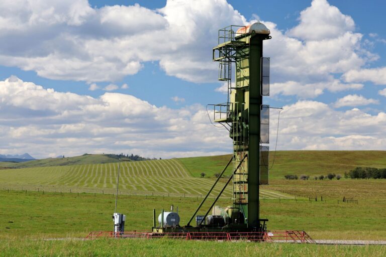 The metal structure is several storeys high with a metal ladder on one side leading to the top.