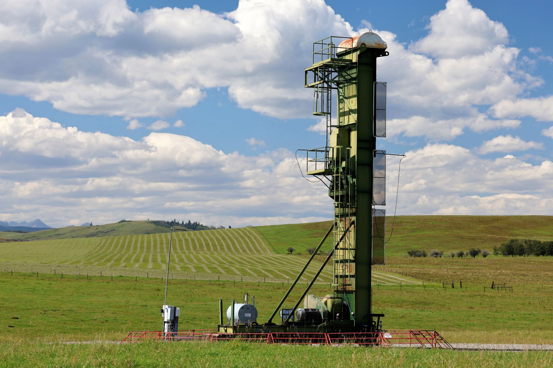 The metal structure is several storeys high with a metal ladder on one side leading to the top.