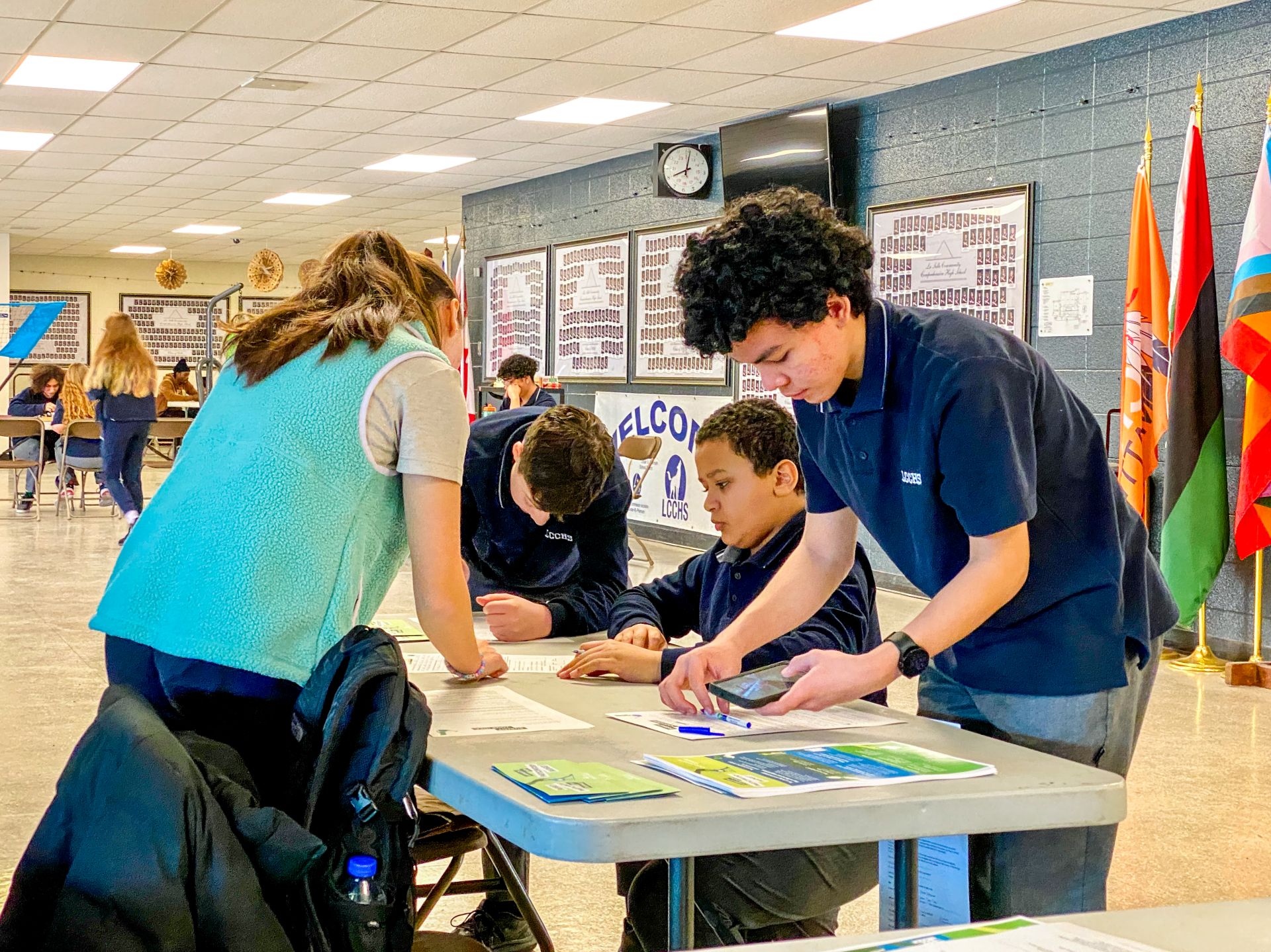 Students filling out participatory budget idea submission form.