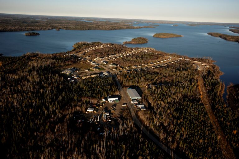 Aerial view of a waterside rural First Nations community.