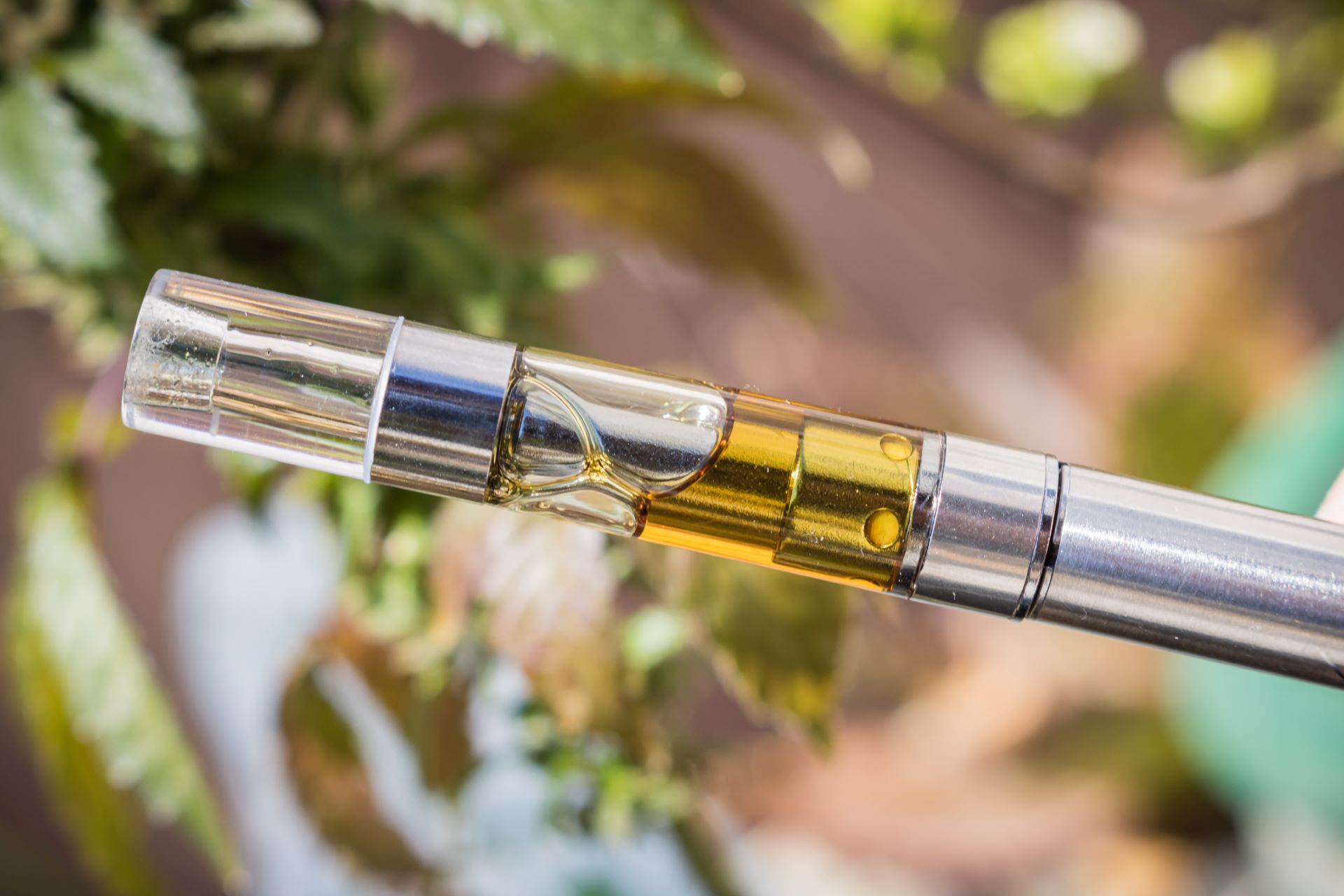 Cannabis vape cartridge with visible THC oil