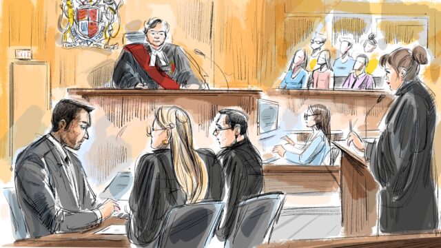 A sketch of Umar Zameer, the accused, in a grey suit alongside gowned lawyers, in front of a judge and jury.