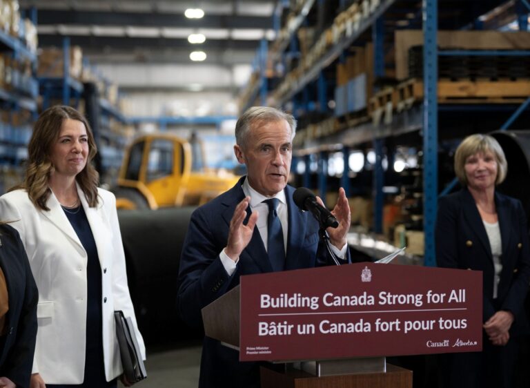 Carney and Smith are in a warehouse with tall shelves and a tractor.